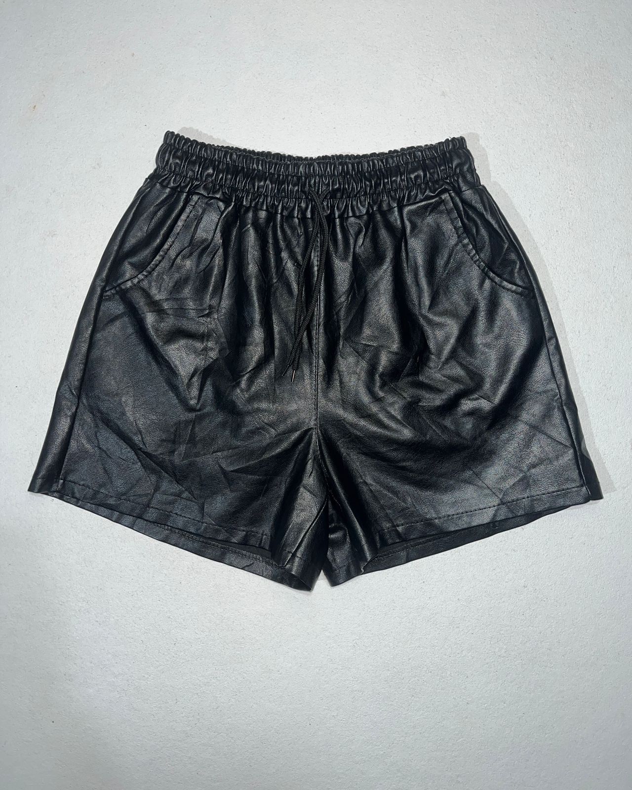 black faux-leather (PU/coated fabric) shorts