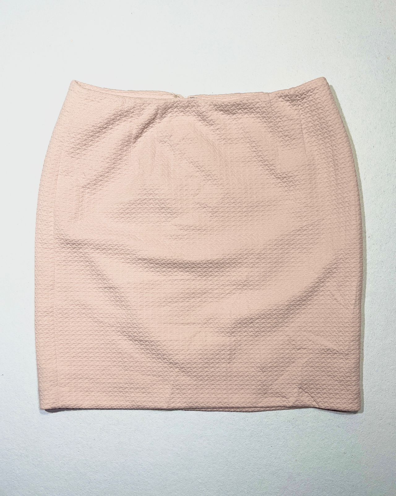 Pastel pink, high-waisted mini skirt